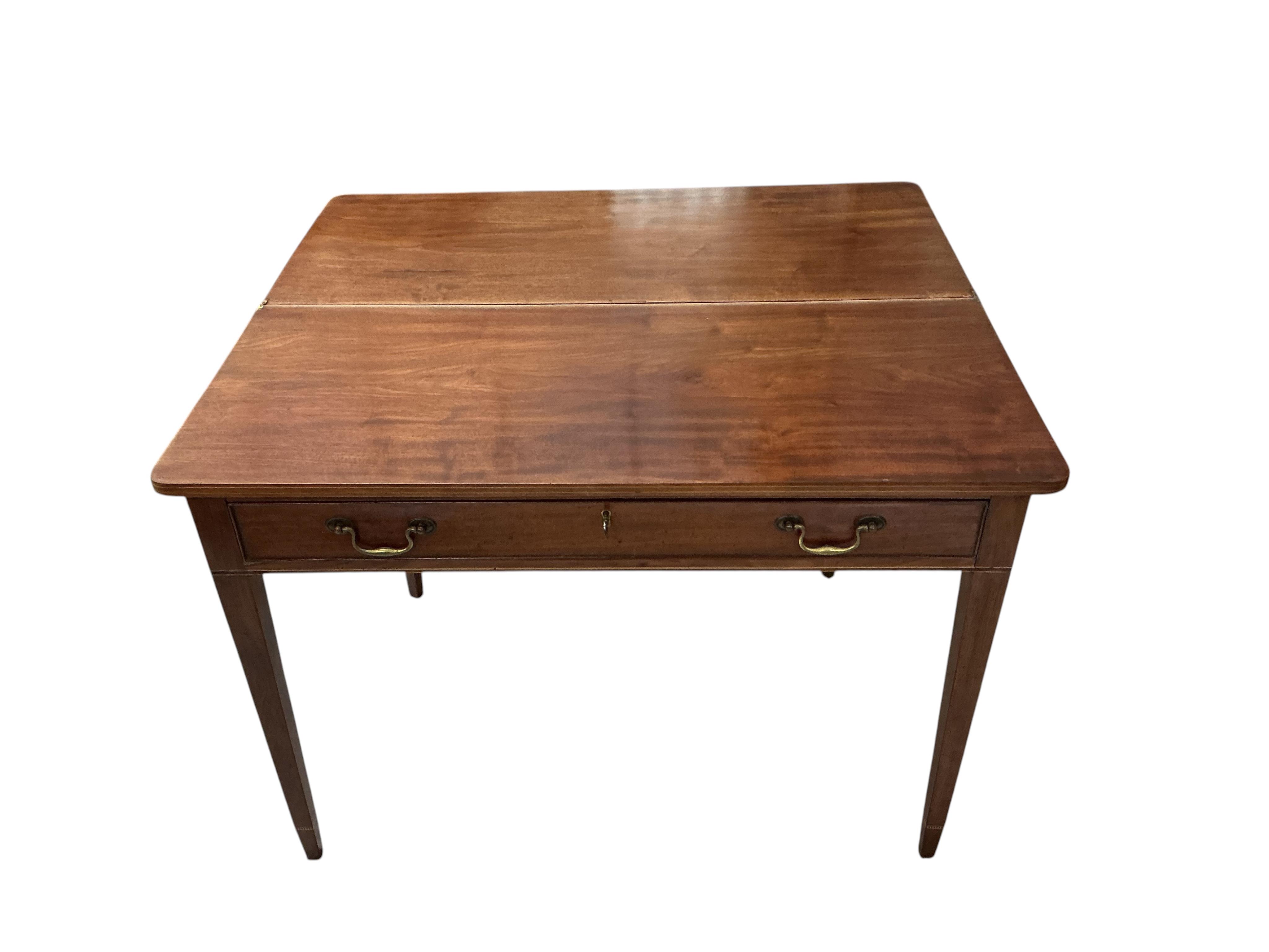 A George III rectangular mahogany folding tea table, width 101cm, depth 43cm, height 72cm
